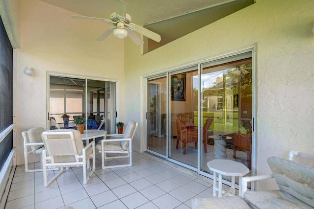 sunroom with a ceiling fan