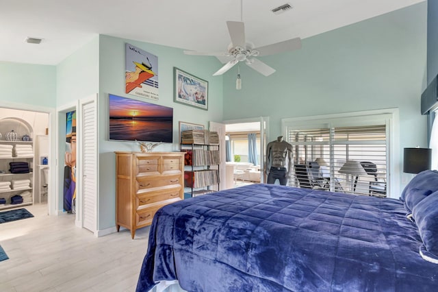 6089 Bay Isles Dr, Boynton Beach, FL 33437 - bedroom with multiple windows, wood finished floors, visible vents, and high vaulted ceiling