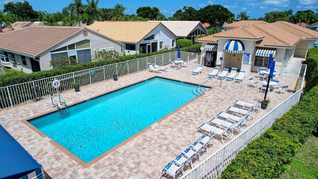 6089 Bay Isles Dr, Boynton Beach, FL 33437 - community pool with a patio and fence
