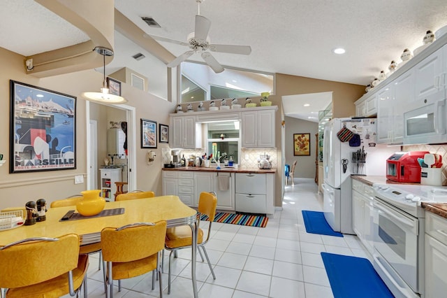 6089 Bay Isles Dr, Boynton Beach, FL 33437 - kitchen featuring visible vents, white appliances, white cabinets, and a ceiling fan