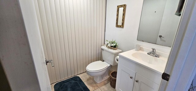 335 S Waverly Pl Unit 7A, Vero Beach, FL 32960 - bathroom featuring tile patterned flooring, toilet, and vanity