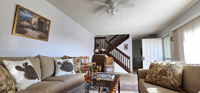 335 S Waverly Pl Unit 7A, Vero Beach, FL 32960 - carpeted living area with stairway, a ceiling fan, and a textured ceiling