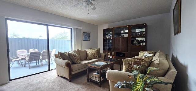335 S Waverly Pl Unit 7A, Vero Beach, FL 32960 - carpeted living area featuring a ceiling fan and a textured ceiling