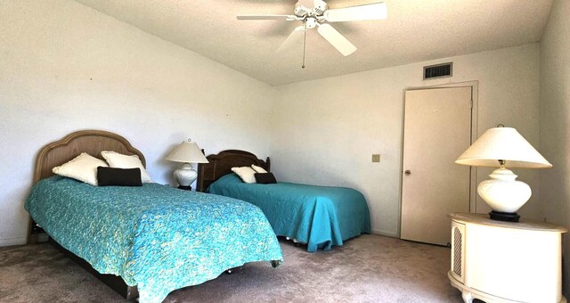 335 S Waverly Pl Unit 7A, Vero Beach, FL 32960 - carpeted bedroom with visible vents, a textured ceiling, and ceiling fan