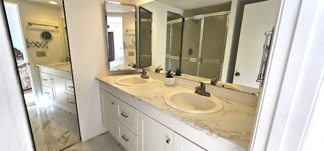 335 S Waverly Pl Unit 7A, Vero Beach, FL 32960 - full bath featuring double vanity, marble finish floor, ensuite bath, and a sink