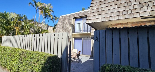 335 S Waverly Pl Unit 7A, Vero Beach, FL 32960 - view of gate featuring fence