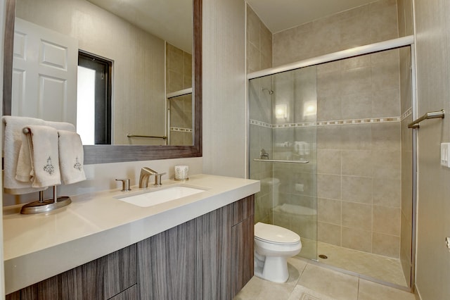 full bath with tile patterned floors, a stall shower, toilet, and vanity