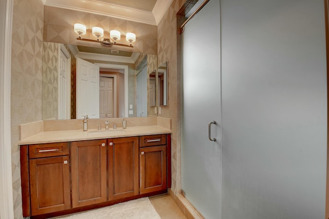 bathroom with crown molding, a stall shower, vanity, and wallpapered walls