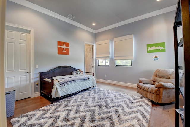 bedroom with visible vents, baseboards, ornamental molding, recessed lighting, and wood finished floors