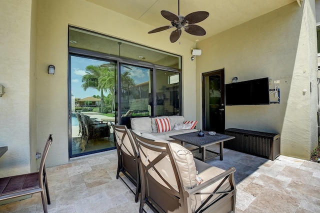 view of patio with outdoor lounge area and a ceiling fan