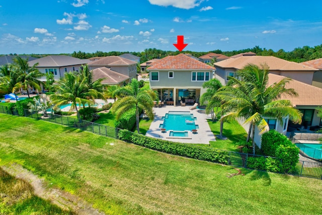 view of swimming pool featuring a fenced in pool, a residential view, a lawn, and a fenced backyard