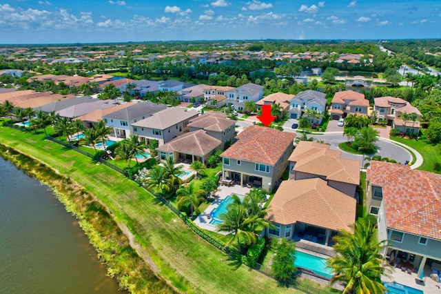 aerial view featuring a residential view and a water view