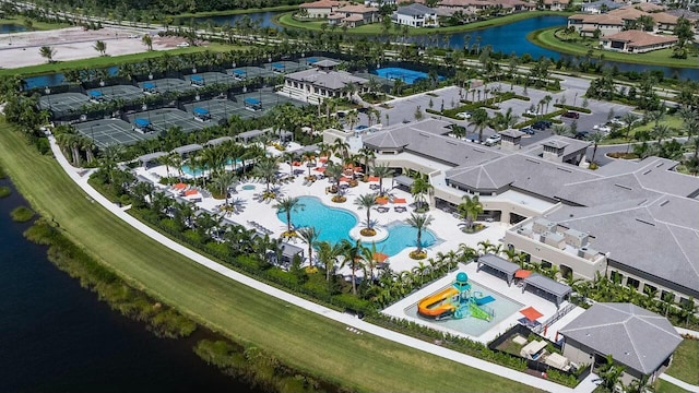 birds eye view of property featuring a water view and a residential view