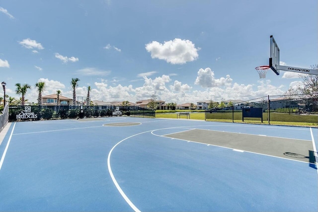 view of sport court featuring community basketball court and fence