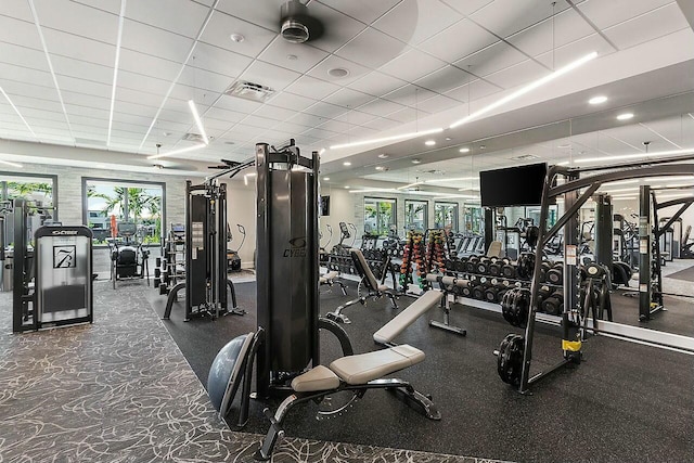 workout area featuring a drop ceiling and visible vents