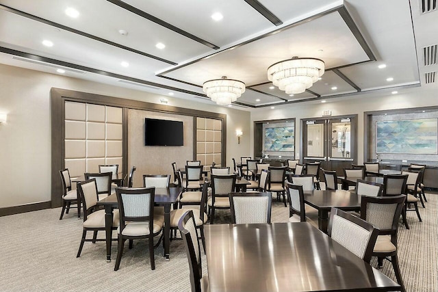 dining space featuring recessed lighting, light colored carpet, visible vents, and an inviting chandelier