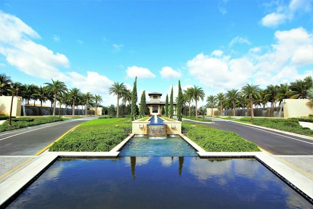 view of swimming pool with a water view