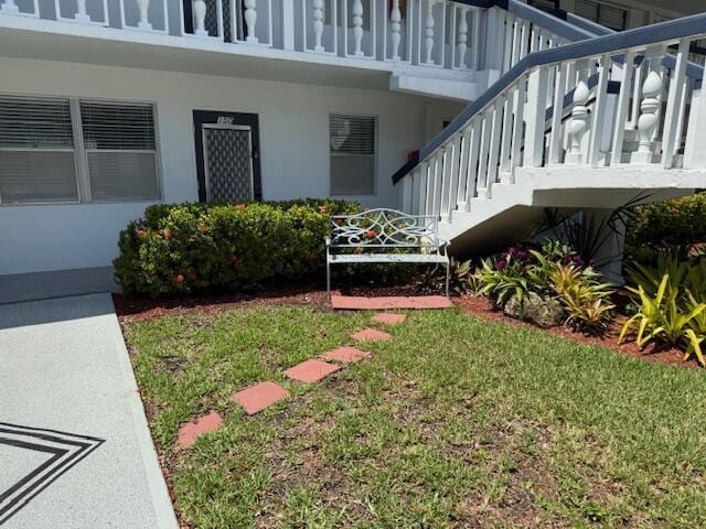 150 Newport J, Deerfield Beach, FL 33442 - view of green lawn featuring stairs