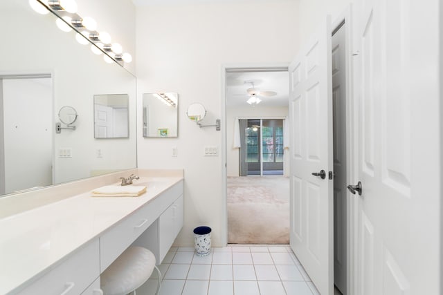 bathroom featuring tile patterned flooring, vanity, and ceiling fan