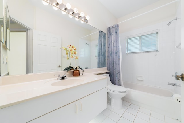 full bathroom with tile patterned floors, shower / bath combo with shower curtain, toilet, and vanity