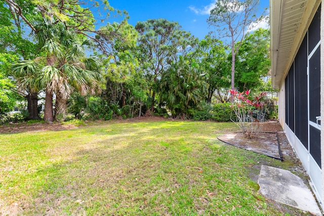 view of yard with a sunroom