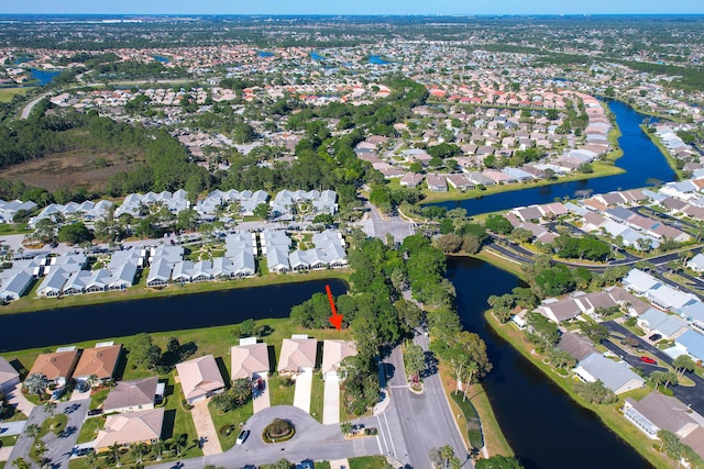 aerial view featuring a residential view and a water view