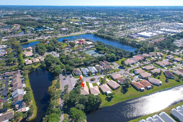 bird's eye view featuring a residential view and a water view