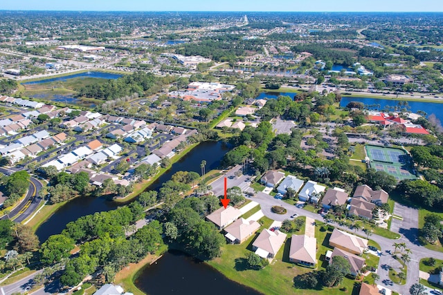 drone / aerial view with a residential view and a water view