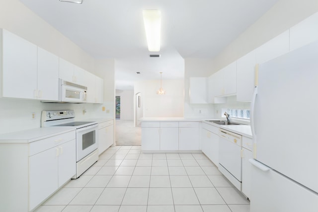 kitchen with light countertops, decorative backsplash, light tile patterned flooring, white appliances, and a sink