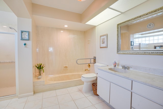 bathroom with vanity, tile patterned floors, and toilet