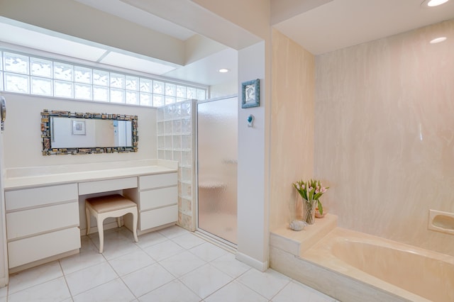 bathroom with tile patterned floors, a bath, a healthy amount of sunlight, and a stall shower