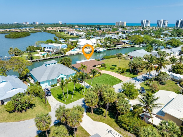 birds eye view of property featuring a water view