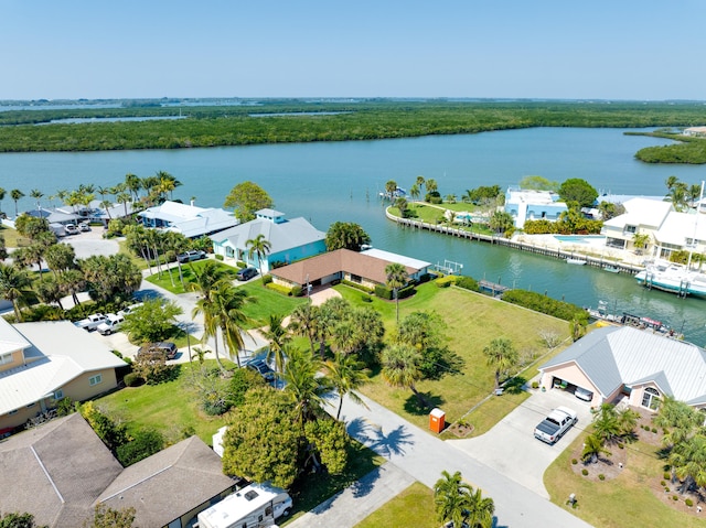 birds eye view of property featuring a residential view and a water view