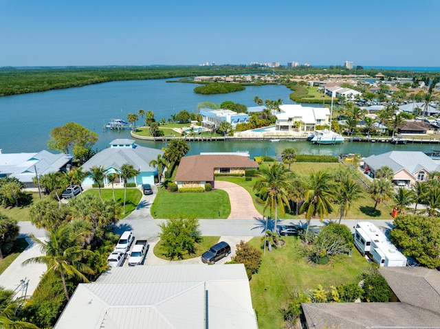 birds eye view of property featuring a water view and a residential view