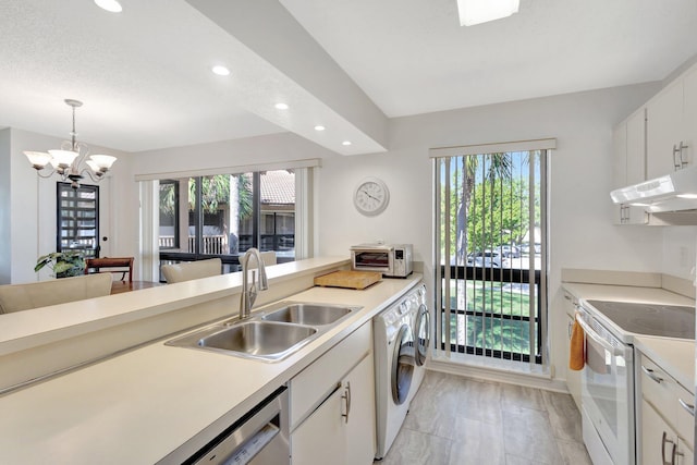 168 Brackenwood Rd, Palm Beach Gardens, FL 33418 - kitchen featuring a notable chandelier, under cabinet range hood, a sink, white range with electric stovetop, and light countertops