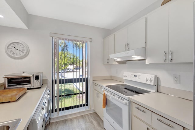 168 Brackenwood Rd, Palm Beach Gardens, FL 33418 - kitchen with white electric stove, a toaster, light countertops, white cabinets, and under cabinet range hood