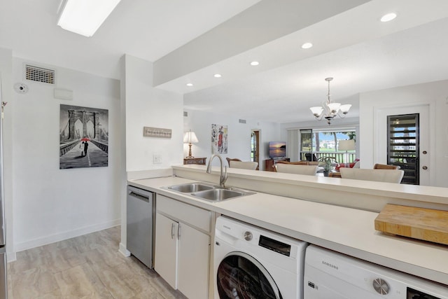 168 Brackenwood Rd, Palm Beach Gardens, FL 33418 - kitchen with visible vents, washer / dryer, dishwasher, and a sink