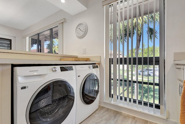 168 Brackenwood Rd, Palm Beach Gardens, FL 33418 - clothes washing area with laundry area, independent washer and dryer, and a wealth of natural light