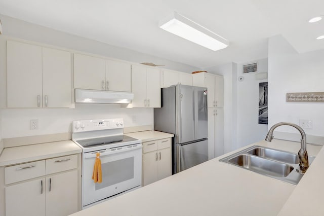168 Brackenwood Rd, Palm Beach Gardens, FL 33418 - kitchen with visible vents, white range with electric cooktop, under cabinet range hood, freestanding refrigerator, and a sink