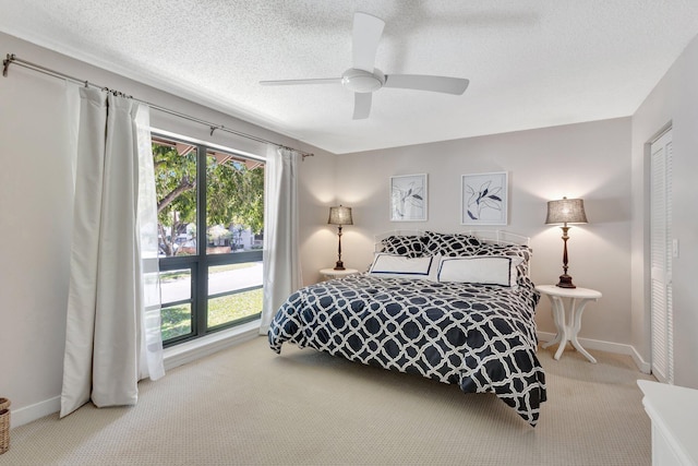 168 Brackenwood Rd, Palm Beach Gardens, FL 33418 - bedroom featuring ceiling fan, carpet flooring, baseboards, and a textured ceiling