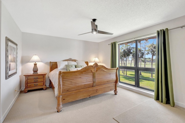 168 Brackenwood Rd, Palm Beach Gardens, FL 33418 - bedroom featuring baseboards, a textured ceiling, carpet, and a ceiling fan