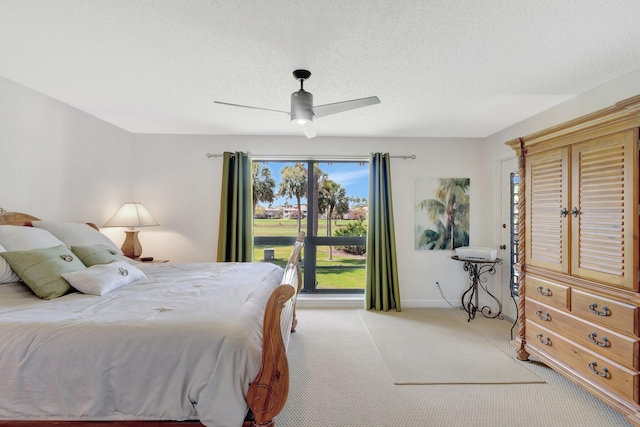 168 Brackenwood Rd, Palm Beach Gardens, FL 33418 - bedroom with baseboards, light colored carpet, a textured ceiling, and ceiling fan