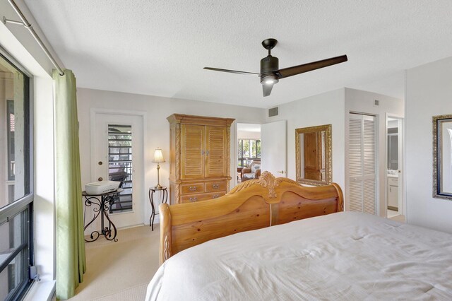 168 Brackenwood Rd, Palm Beach Gardens, FL 33418 - bedroom with ceiling fan, a closet, a textured ceiling, carpet flooring, and connected bathroom