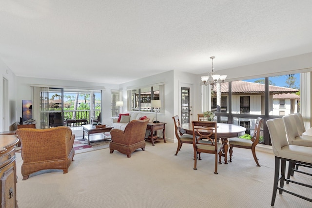 168 Brackenwood Rd, Palm Beach Gardens, FL 33418 - dining room featuring light carpet, baseboards, a textured ceiling, and an inviting chandelier