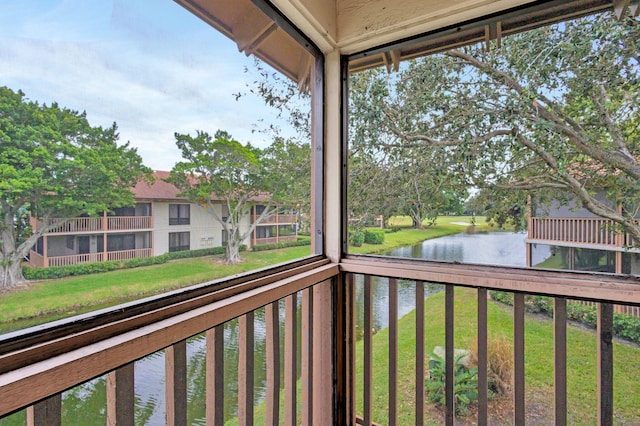 balcony featuring a water view