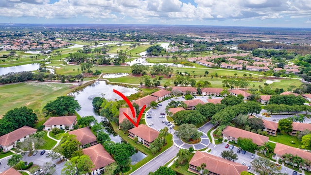 bird's eye view with a residential view, golf course view, and a water view