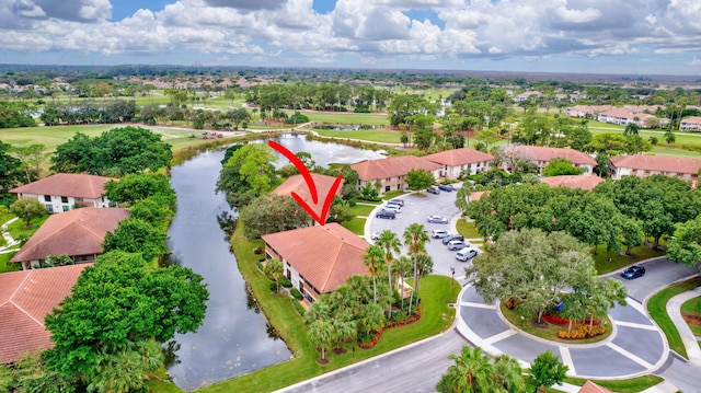 bird's eye view featuring a water view and a residential view