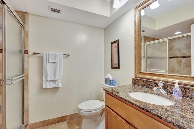 bathroom featuring visible vents, toilet, a shower stall, tile patterned flooring, and vanity