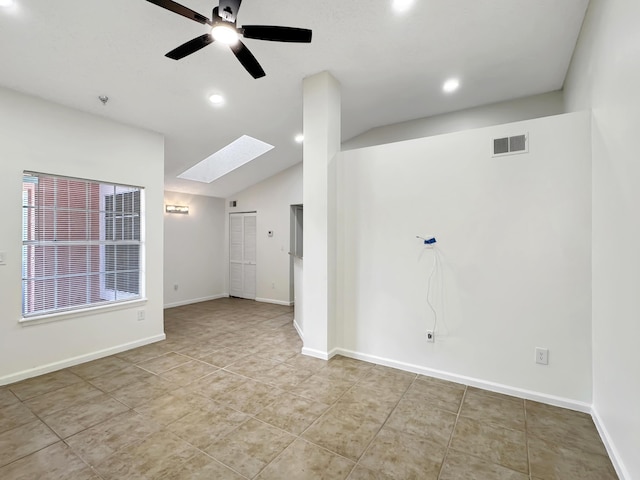 1335 Crystal Way Unit L, Delray Beach, FL 33444 - tiled empty room featuring a skylight, vaulted ceiling, a ceiling fan, recessed lighting, and baseboards
