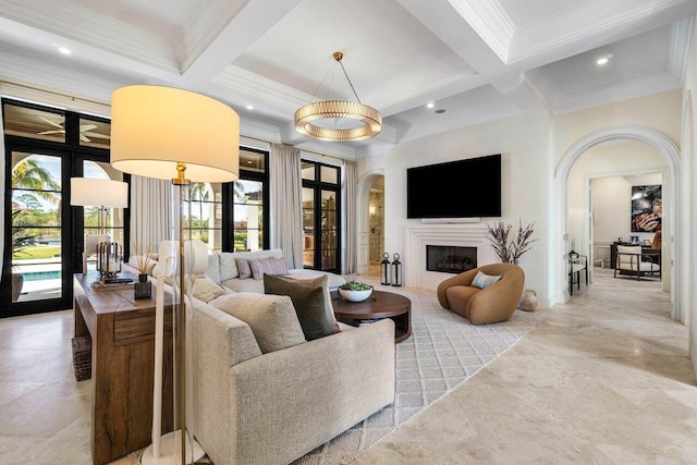 living area with crown molding, beamed ceiling, arched walkways, and coffered ceiling